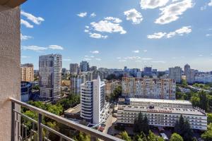 a view of a city from a balcony at Rodos ArCadia Apartments in Odesa +7 photos
