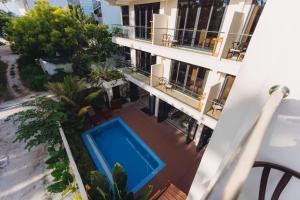 an aerial view of a building with a swimming pool at Aire Dharavandhoo in Dharavandhoo