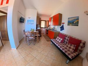 a living room with a couch and a table at Villa Grazia in Santa Lucia