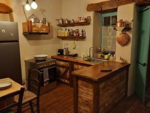 a kitchen with a sink and a counter top at Casa Sofia in Mytilinioí