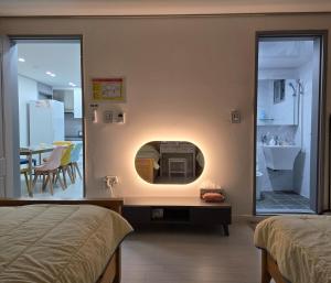 a bedroom with a fire place in the wall at Love & Travel House in Seoul