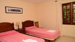 Postel nebo postele na pokoji v ubytování Apt. Heliconia Nº 4