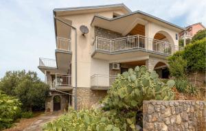 a house with balconies on the side of it at Gorgeous Apartment In Sveti Juraj With Wifi in Sveti Juraj