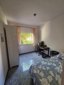 Postel nebo postele na pokoji v ubytování Apartamento Suíte e Dormitório próximo ao Hangar