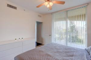 a bedroom with a bed and a ceiling fan at Apartment In Casa Costa Condo!beach Pass Included in Boynton Beach +18 photos