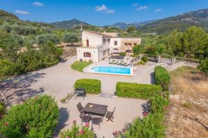 an aerial view of a house with a swimming pool at Sa Corterada in El Port de la Selva