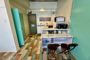 Kuchyň nebo kuchyňský kout v ubytování 白浜ペットフレンドリーハウス