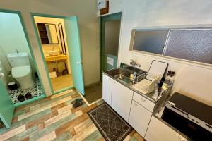 Koupelna v ubytování 白浜ペットフレンドリーハウス + 19 fotografií