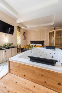 a large white tub in a room with a living room at Dream Room in Mercato San Severino +89 photos