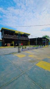 an empty parking lot in front of a building at La Casa Royal Hotel 