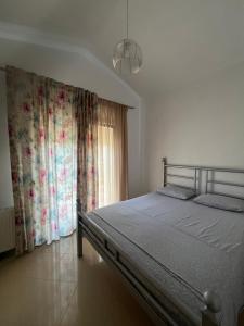 a bedroom with a bed and a window at Elani villa''s in Elani