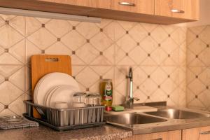 Kuchyň nebo kuchyňský kout v ubytování VELDI Apartment + 5 fotografií
