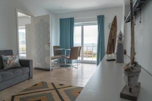 a living room with a couch and a table at Villas da Salga in Angra do Heroísmo