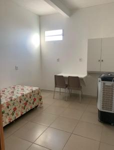 Ένα ή περισσότερα κρεβάτια σε δωμάτιο στο Terezinha Pousada