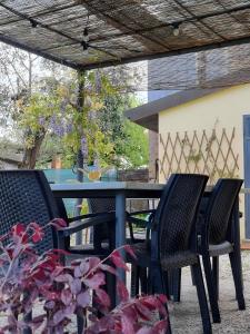 two chairs and a table on a patio at Casa Marcobando - Lucca in Lucca