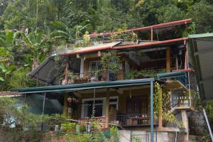 a house on the side of a mountain at Secret View Homestay Ella in Ella