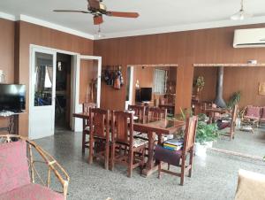 a dining room with a table and chairs at Toto in San Juan