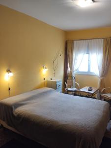 Postel nebo postele na pokoji v ubytování Toto