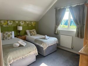 Postel nebo postele na pokoji v ubytování 5A Retallack Resort & Spa