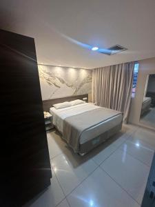 En eller flere senge i et værelse på Flat 235, Imperial Flat Tambau NOBILE 2andar