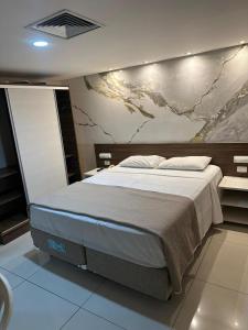 En eller flere senge i et værelse på Flat 235, Imperial Flat Tambau NOBILE 2andar