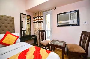 Ένα ή περισσότερα κρεβάτια σε δωμάτιο στο Prime Hotel Star View'Near RK ashram metro'5min from New Delhi railway station and Connaught place +67 φωτογραφίες