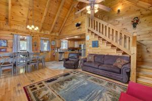 a living room with a couch and a staircase in a cabin at Dream View in Greystone Heights
