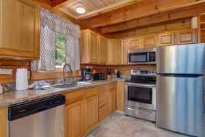 a kitchen with wooden cabinets and a stainless steel refrigerator at Dream View in Greystone Heights
