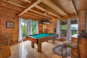 a game room with a pool table in a cabin at Dream View in Greystone Heights +37 photos