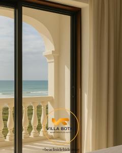 a window with a view of the ocean at Casa da Praia in Paredes da Vitória