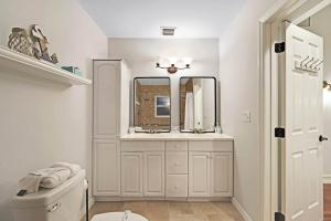 a bathroom with a sink and a toilet and a mirror at Home Wpool By Pmi Unit Dfs in Deerfield Beach +33 photos