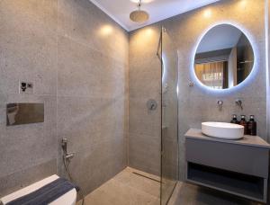 a bathroom with a sink and a shower with a mirror at Alba Boutique Hotel in Chania Town +52 photos