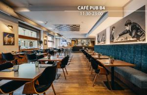 a restaurant with tables and chairs and a bar at Metropolitan Old Town Hotel - Czech Leading Hotels in Prague