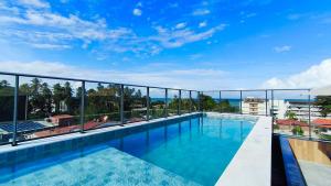 a swimming pool on the roof of a building at Nawa Residence - Praia de Tamandaré in Tamandaré
