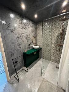 a bathroom with a sink and a shower at A Scontra in Moïta +60 photos
