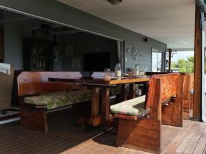 a dining room with a wooden table and chairs at Santa Vista 1 in Santa Maria