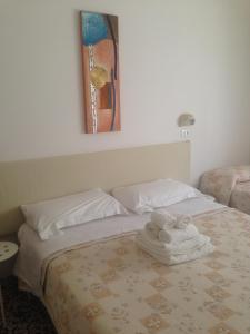 Postel nebo postele na pokoji v ubytování Hotel Lucerna