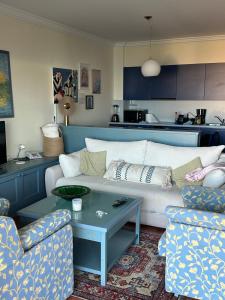 a living room with a couch and two chairs and a table at 5 star Luxury Apartment Sea View Terrace Skiper Resort in Savudrija