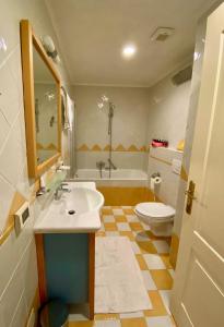 a bathroom with a sink and a toilet and a tub at 5 star Luxury Apartment Sea View Terrace Skiper Resort in Savudrija