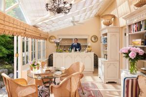 a dining room with a table and chairs at Summer Lodge Country House Hotel in Evershot +74 photos