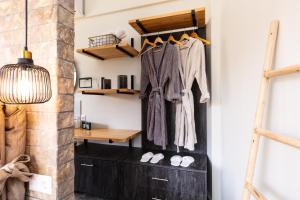 a room with a black chest of drawers and a shelf at Tripiti Cozy Flat in Damnoni +22 photos