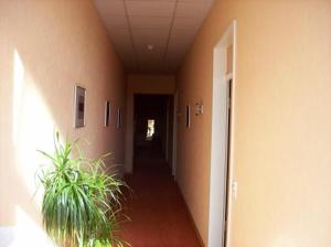 a room with a door leading to a hallway at Econo Motel Goelzer in Büchenbeuren