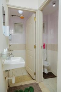 a bathroom with a sink and a toilet at 44 luxurious Unity homes in Ongata Rongai  +25 photos