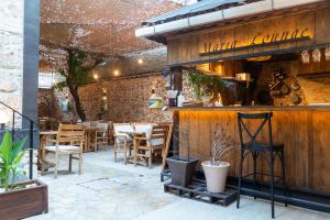 a restaurant with tables and chairs in a patio at Casa Maria Hotel in Antalya