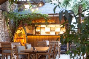 a restaurant with tables and chairs in front of a building at Casa Maria Hotel in Antalya