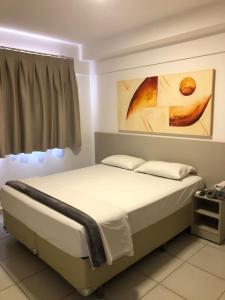 Evian thermas residence APART- HOTEL房間的床