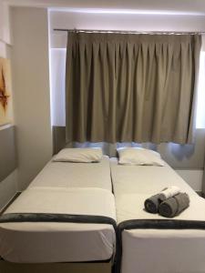 Evian thermas residence APART- HOTEL房間的床