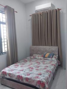 En eller flere senge i et værelse på mzm guest house