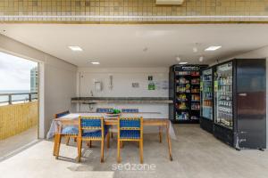 Η κουζίνα ή μικρή κουζίνα στο Aptos completos em em prédio com piscina a 400m da praia - PZO