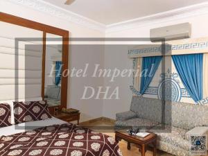 a bedroom with a bed and a couch at Hotel Imperial Karachi in Karachi +26 photos